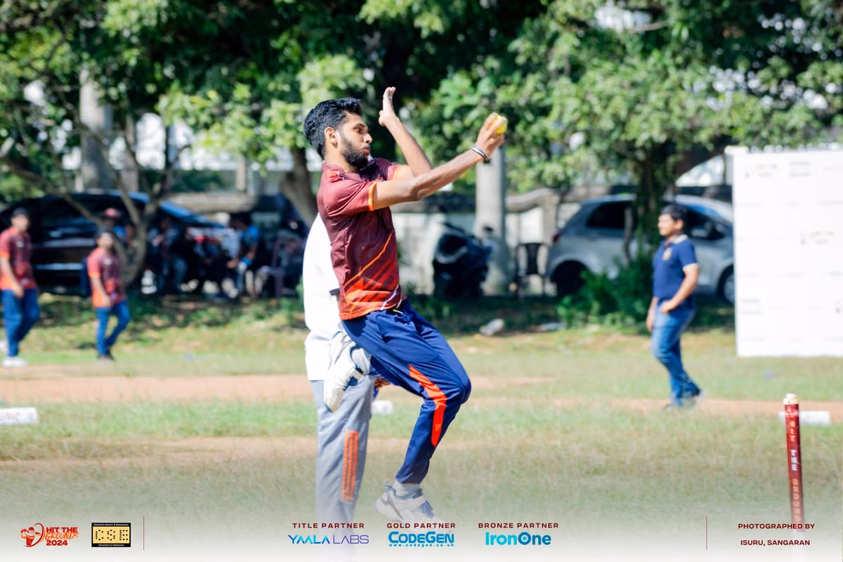 A bowler in mid-delivery stride