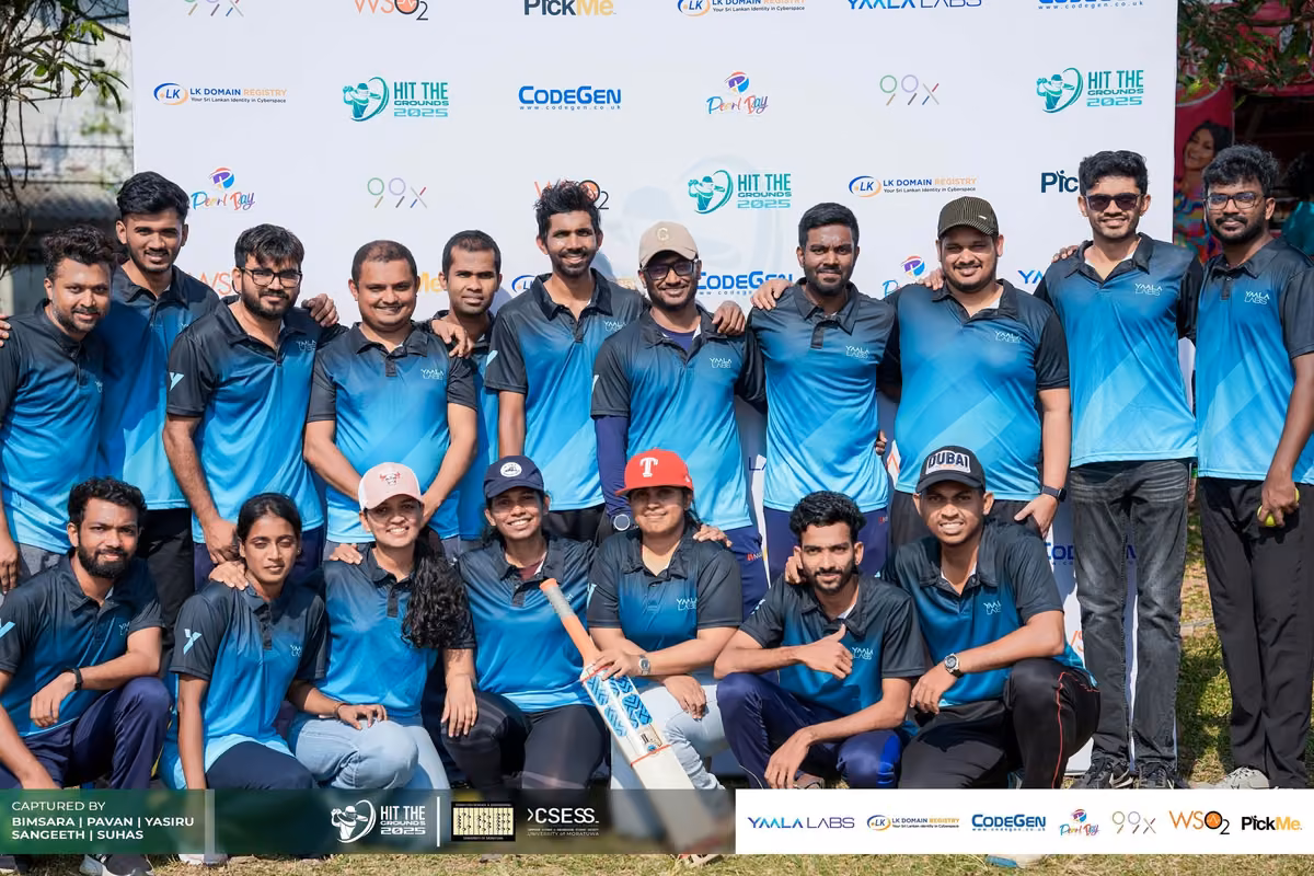 The teal-jersey team posing together