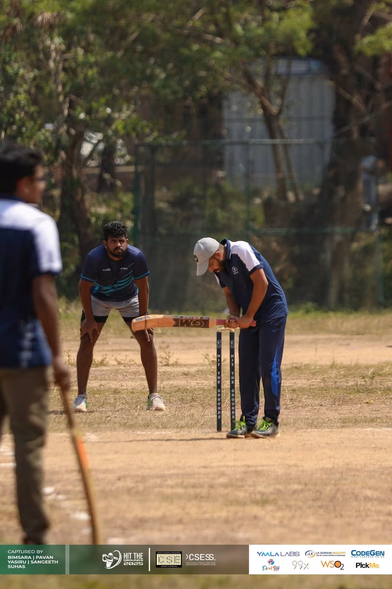 The wicketkeeper and umpire at the stumps