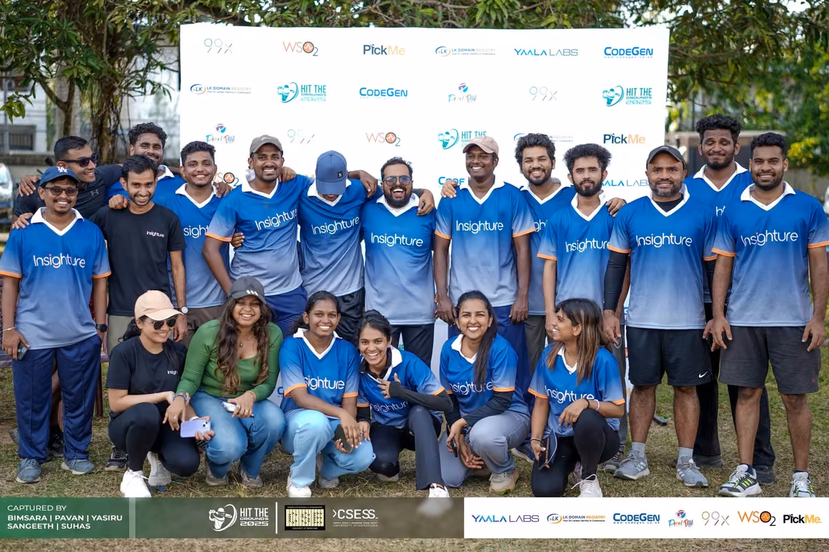 A blue-jersey team group photo at the backdrop