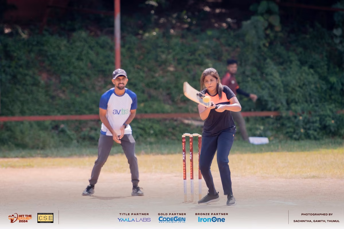 A batter at the stumps with the keeper crouched behind