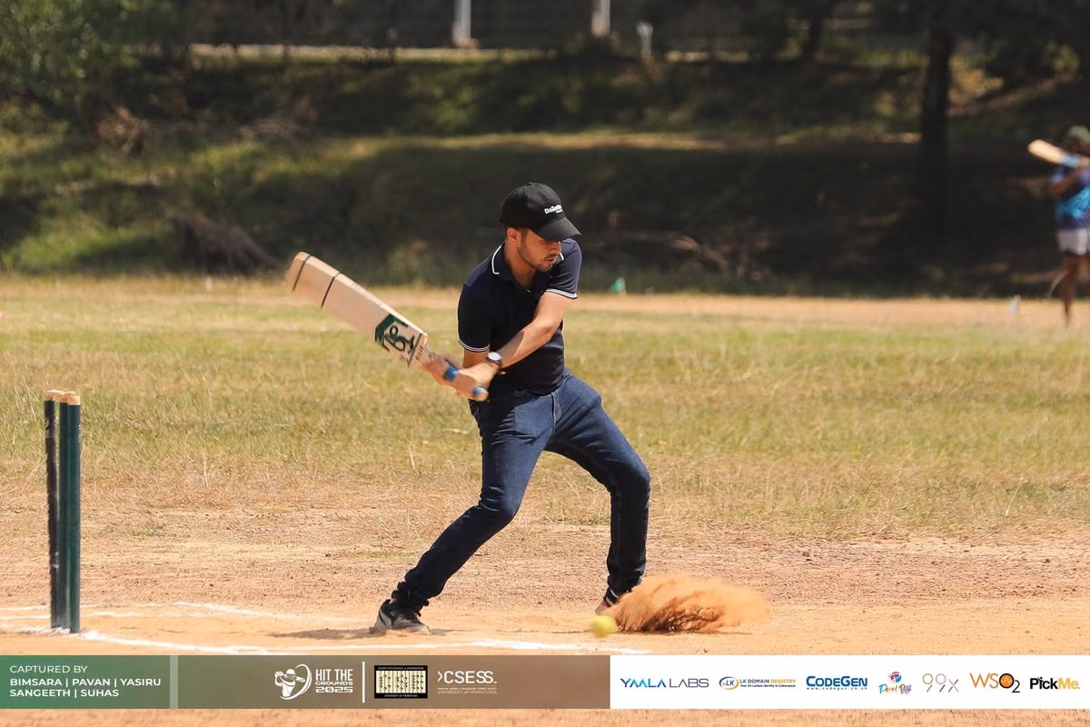 A batter swinging at a delivery